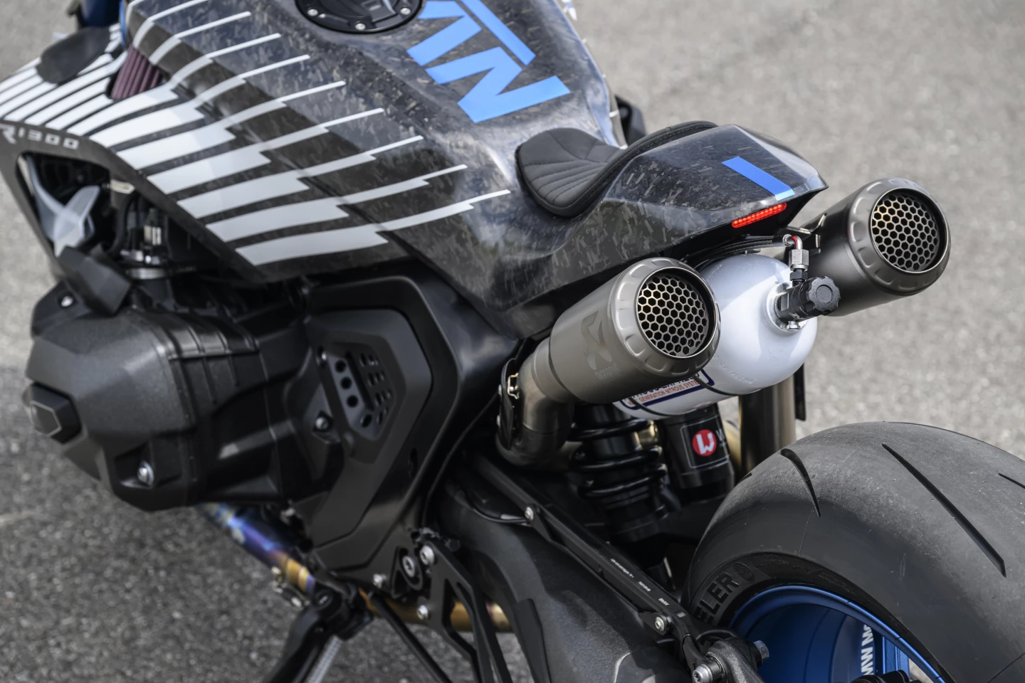 A can of nitrous sits between the two rear titanium silencers