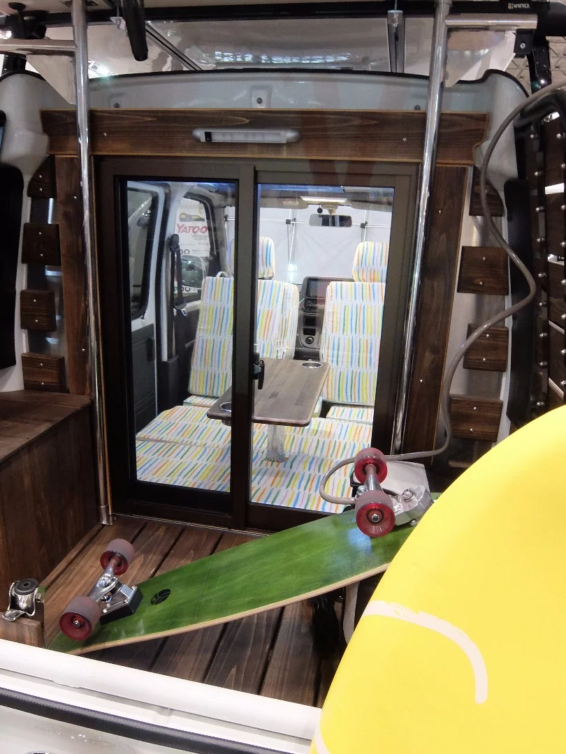The rear storage area of the Deck Cruiser by KARUCAN accommodates skateboards and surfboards