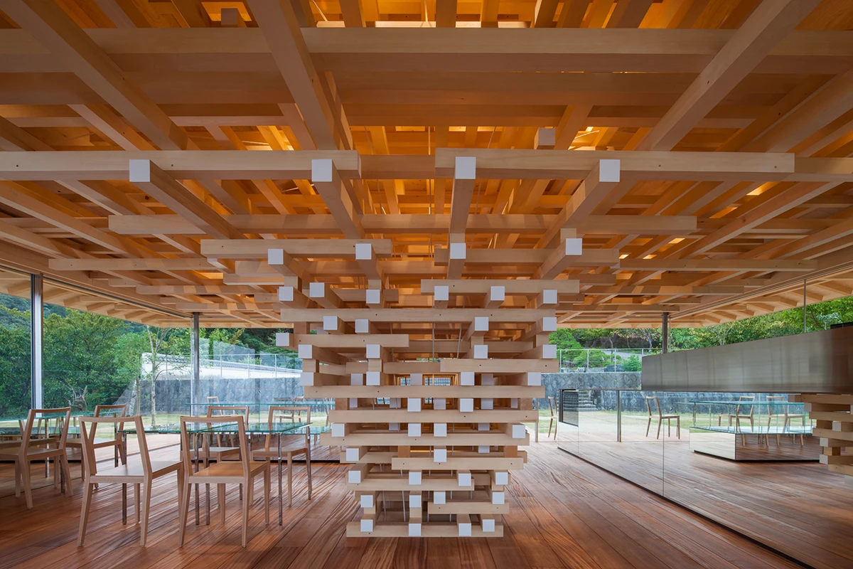 The Coeda House café takes its design cues from a tree, and uses a stack of cedar blocks as its "trunk"