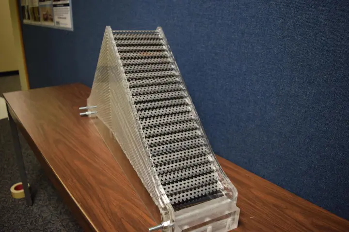 Metamaterials redirect approaching waves around an object without scattering the wave energy, concealing the object from the sound waves
