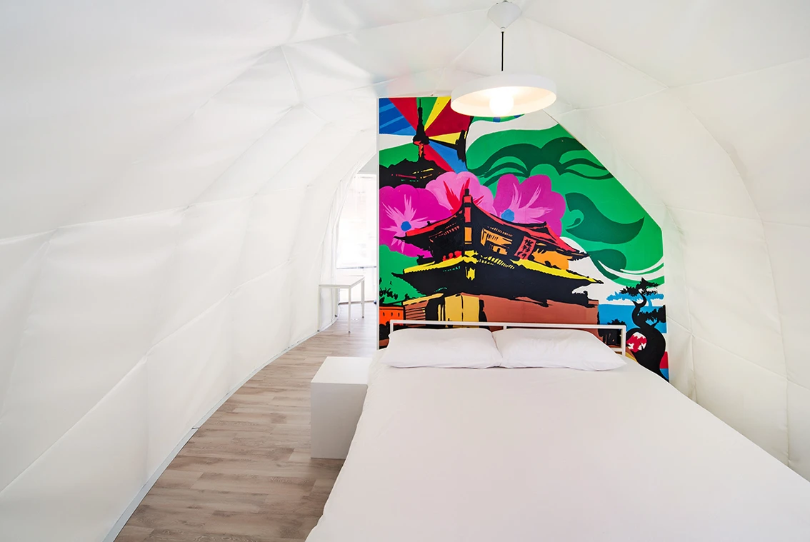 The bathroom is hidden away within the two dramatic art walls (Photo: June Young Lim)