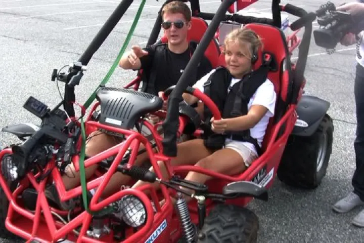 A blind volunteer trying out Virginia Tech's BDC system in a dune buggy