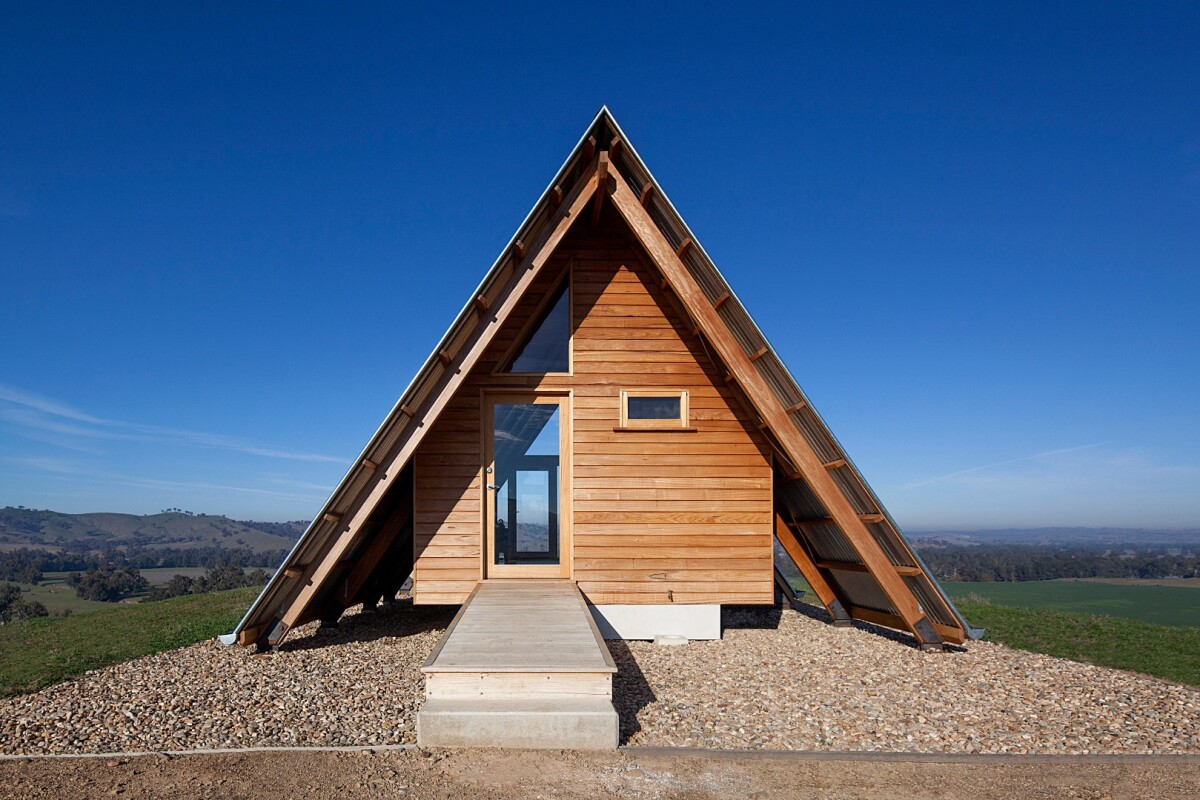 Inside the solar-powered JR's Hut is a bed for two, bathroom with a view and freestanding wood burner fireplace