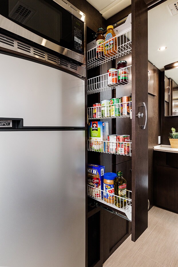 Unity motorhome combines Murphy bed and swivel recliners in comfy