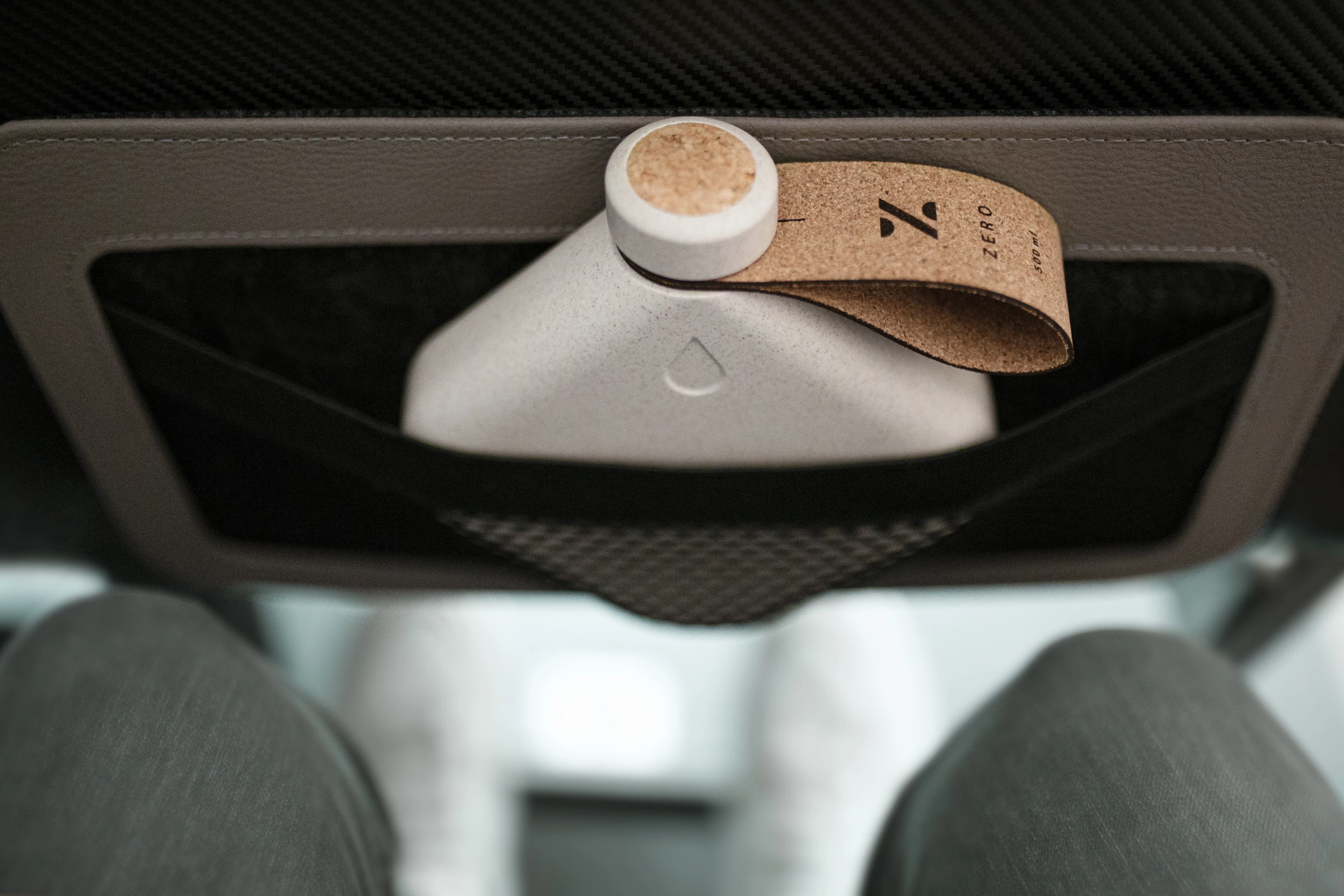 The shape of the bottle fits perfectly in the pocket of an aircraft seat back
