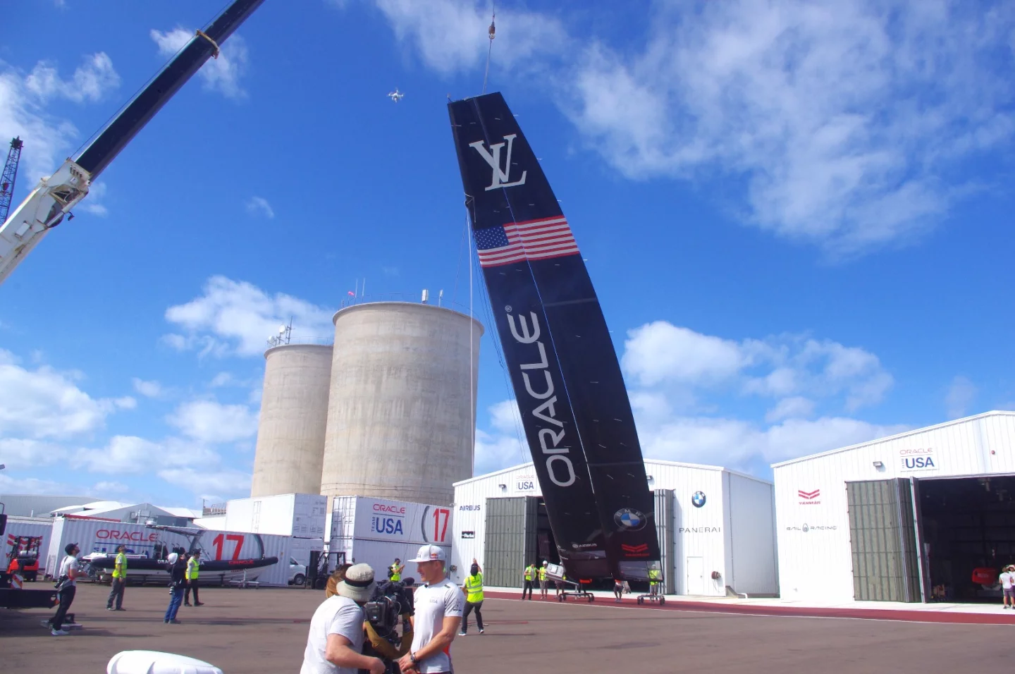 The yacht's sail, which is known as a wing, being removed from the hangar. It is made from carbon fiber and measures 24 m (78.74 ft).