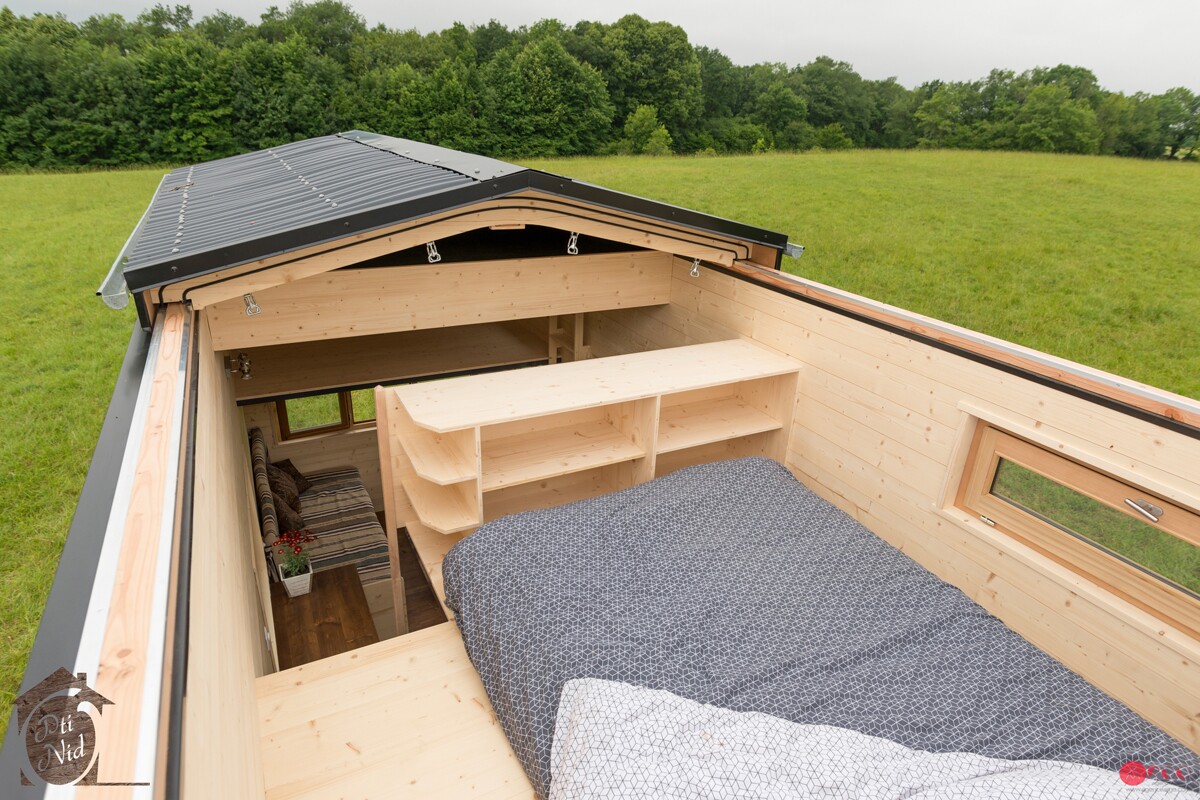 Tiny house opens up to the sun with sliding roof