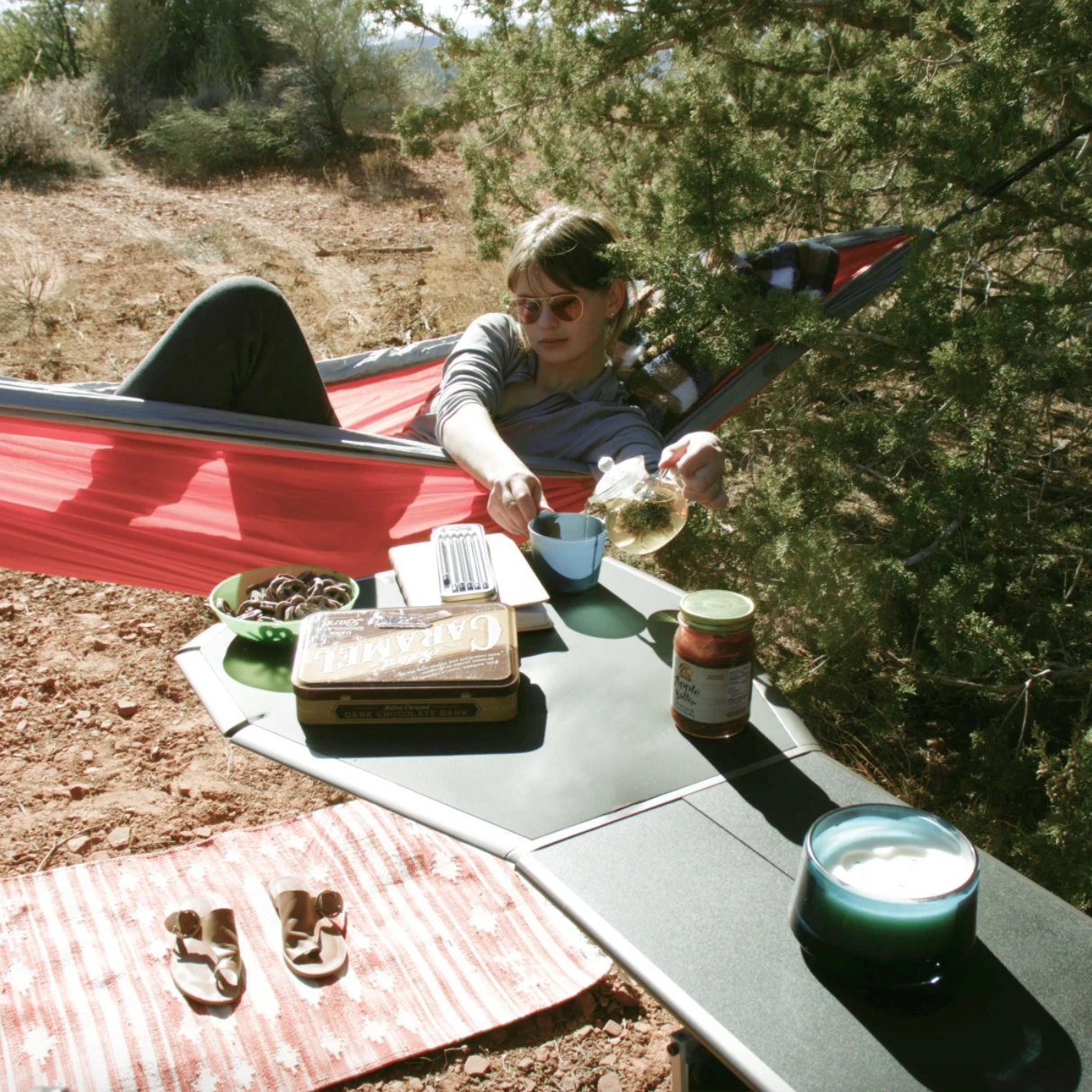 The Tail Table is topped with changeable, dishwasher-safe food preparation mats and a chopping board