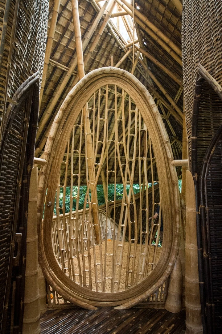 The entrance to the Temple House is marked by a peculiar egg-shaped swinging door