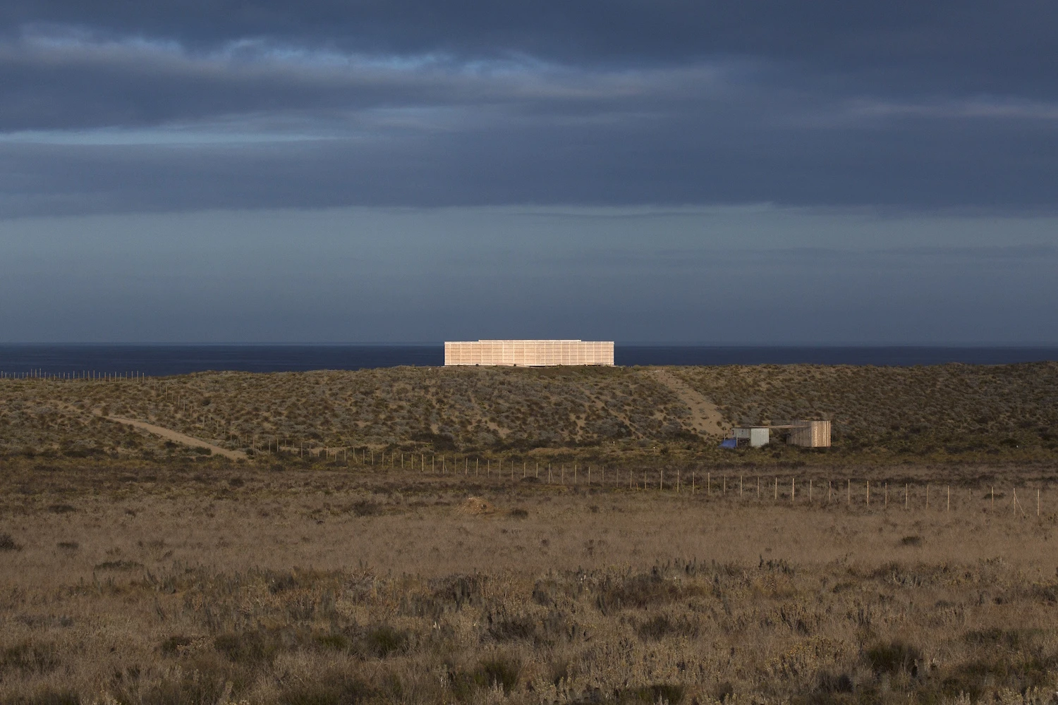The House in Morrillos is located atop a dune in Morrillos, Chile