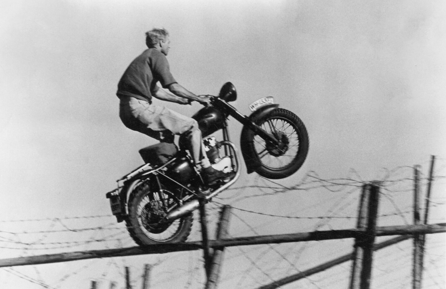 Bud Ekins is best known as Steve McQueen's stunt double who performed the famous jump over the barbed wire fence in The Great Escape.