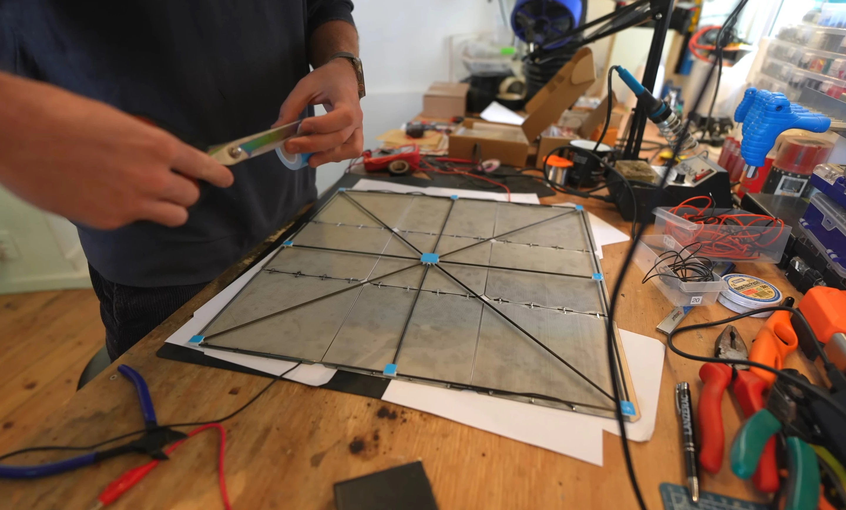 Three sets of nine solar cells are connected in series and mounted to the drone's X-frame