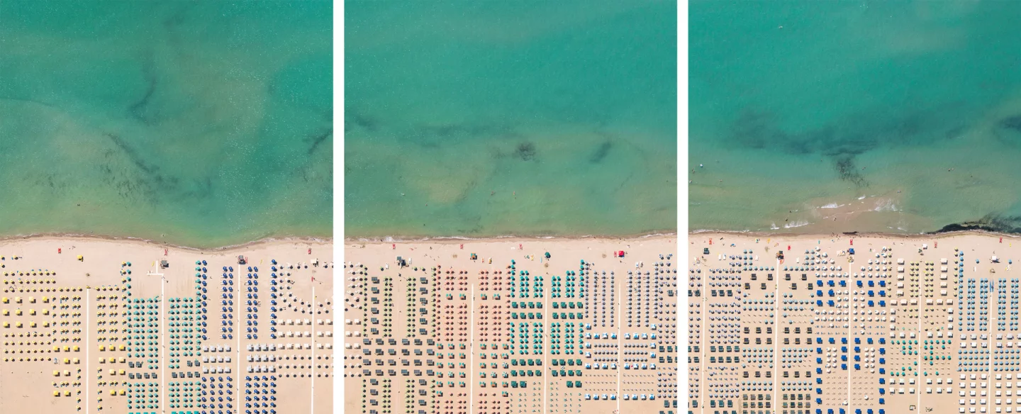 One of Lang's personal favorite photographs, a triptych of beach umbrellas in Versilia, Tuscany