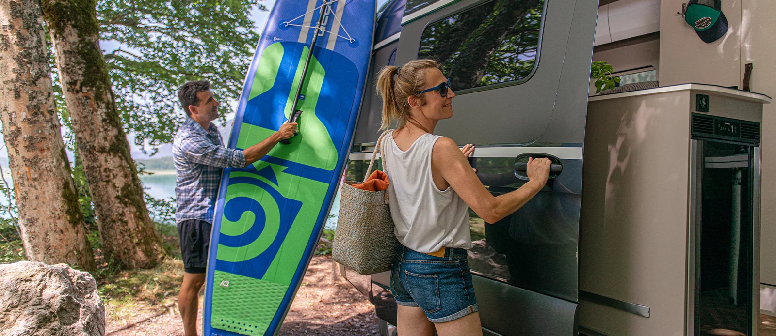 The fridge at the end of the kitchen block can open from inside or out