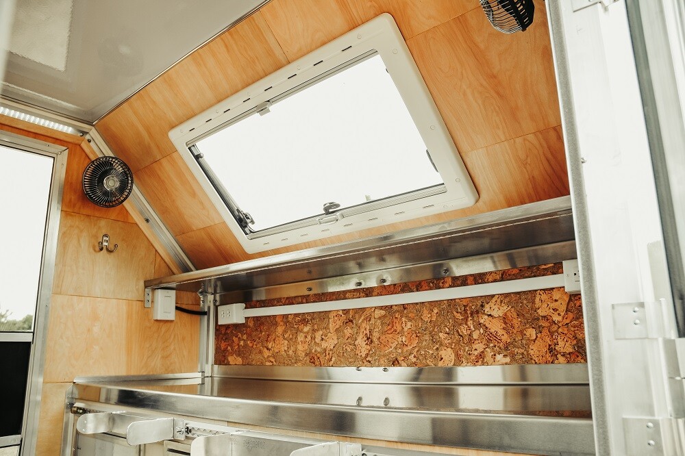 The Sequoia includes an interior countertop/cabinetry unit with cork backsplash