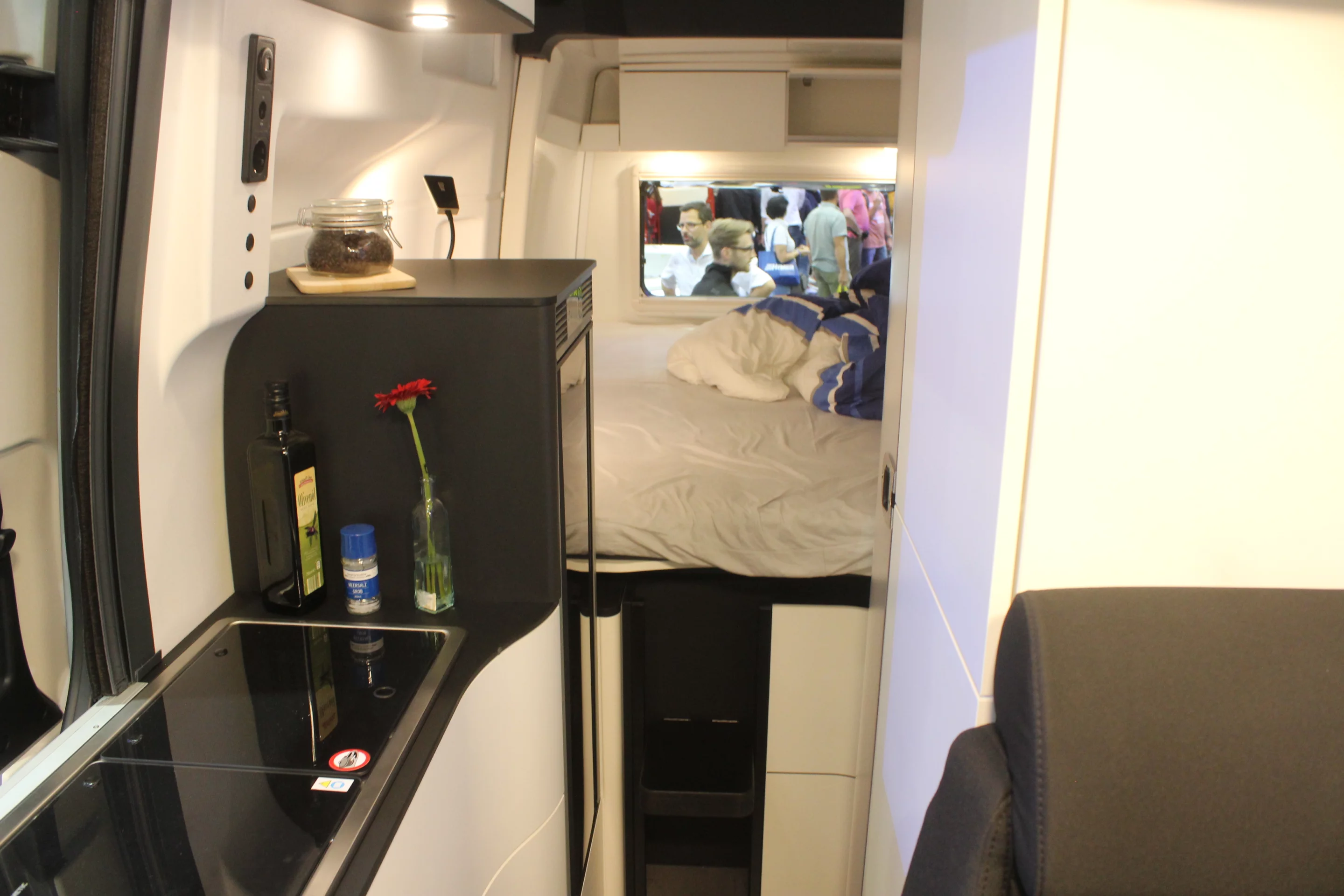 The kitchen and bedroom are split by the tall 90-L fridge