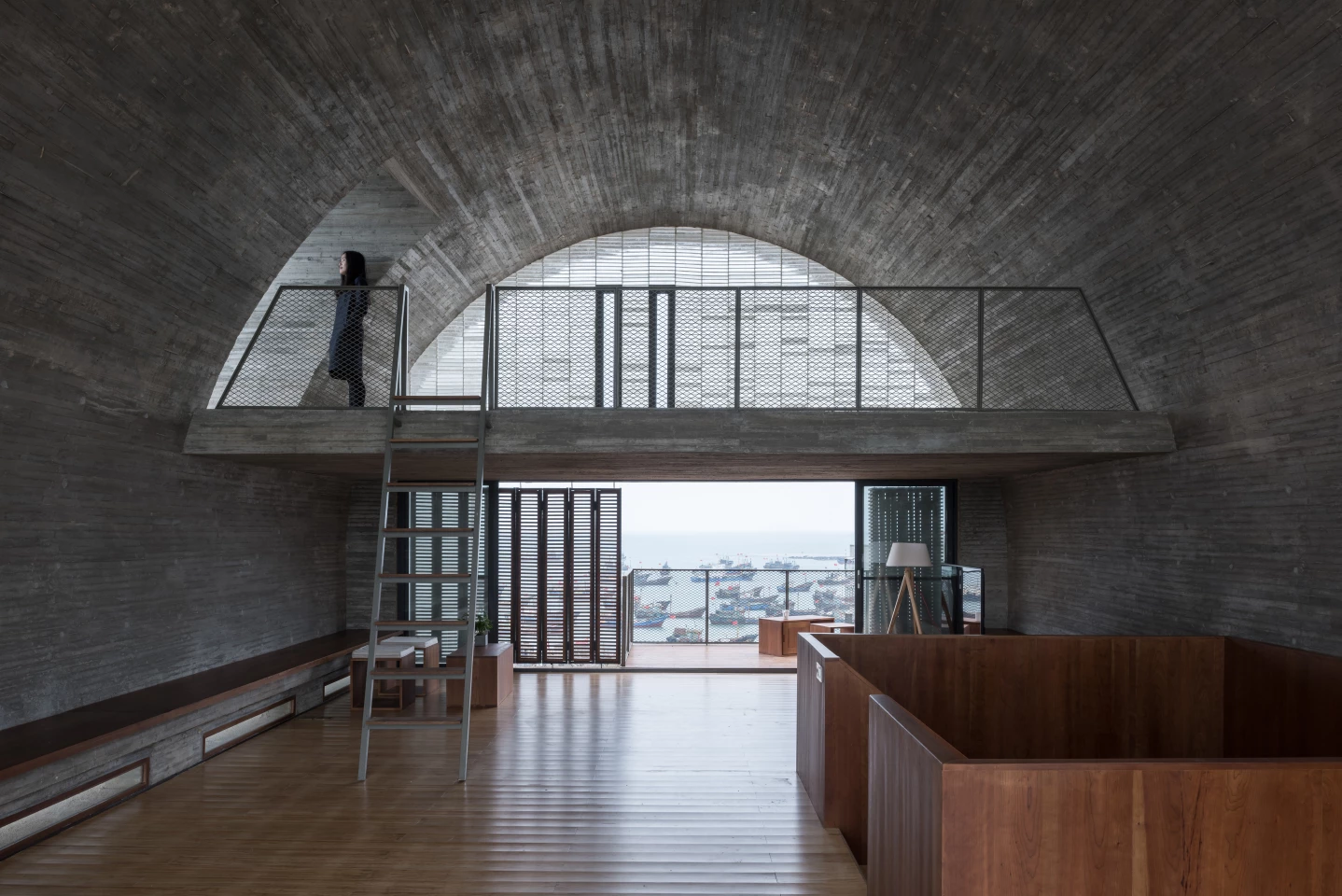 Renovation of the Captain's House was designed by Vector Architects and is located in China. The project involved the refurbishment and extension of an existing ship's captain's house poised on the water's edge overlooking the East China Sea. It's defined by a distinctive barrel-vaulted roof