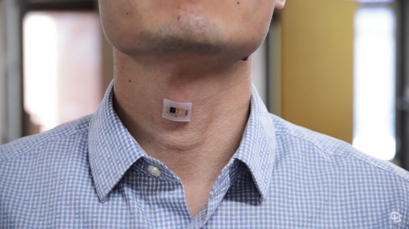 The monitor in place on a researcher's neck