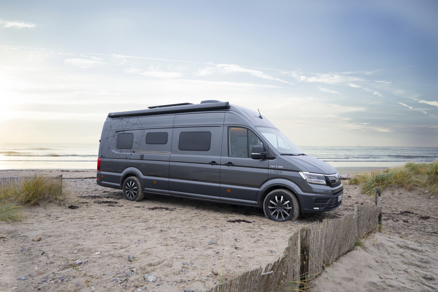 The extra-long 739-cm base MAN TGE van gives Loef the space it needs to add all the usual four-person camper van equipment, along with a second dining lounge and outdoor cooking/bartending amenities