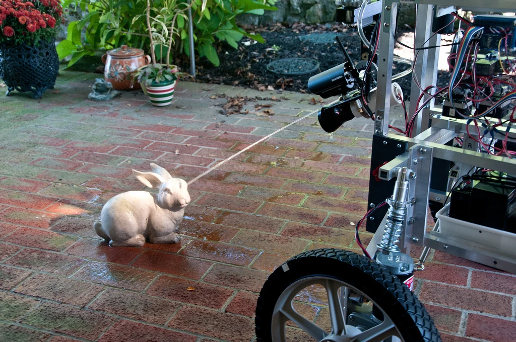 The PatrolBot Mark II shows an unsuspecting garden sculpture who's boss