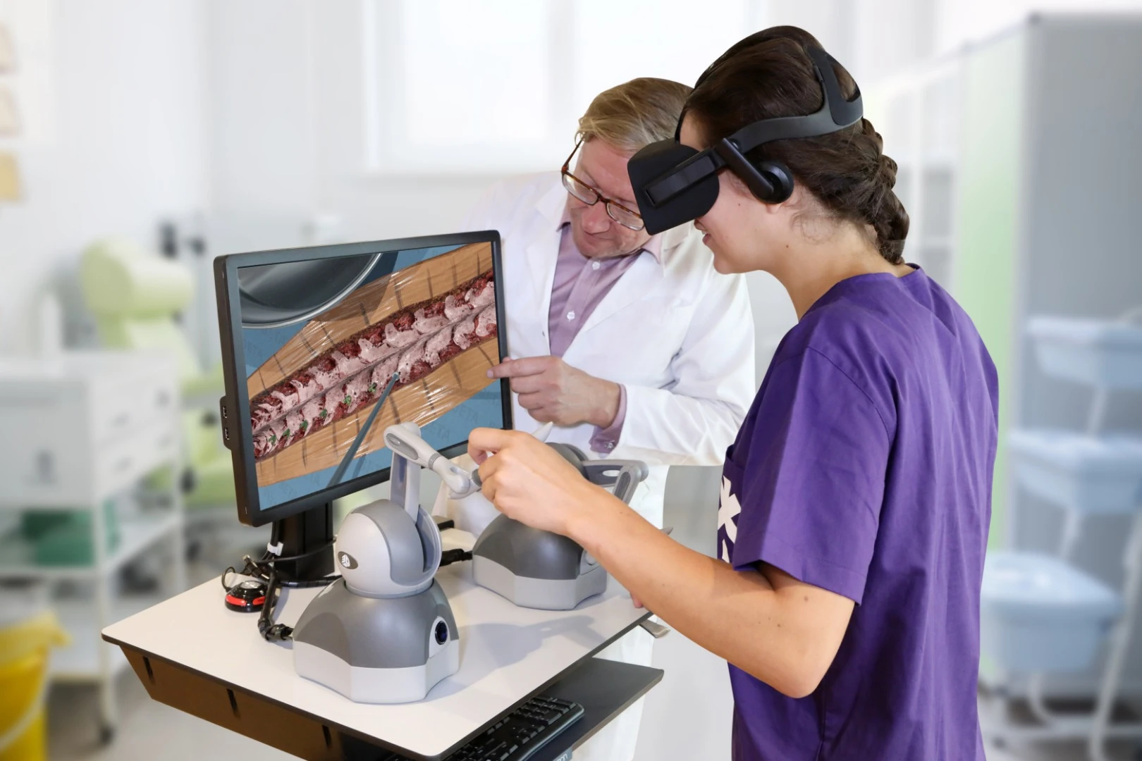 A student uses the Fundamental Surgery system to perform a virtual spinal operation