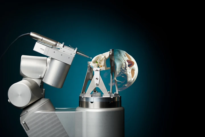 Scientists have developed a robot that automatically bores through the skull to make cranial surgery safer, faster and cheaper