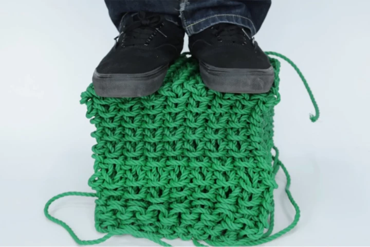 Despite the large cable, the solid-knitting objects are deceptively firm