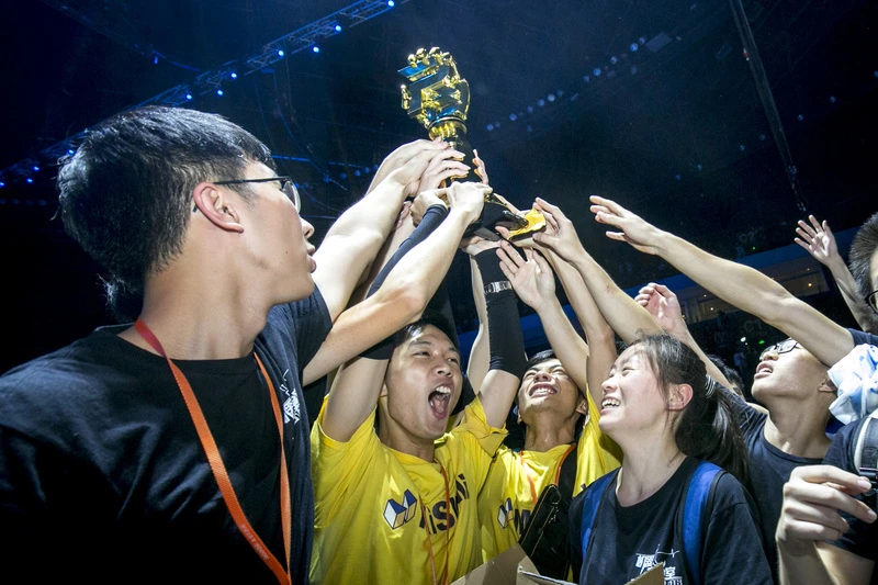 Members of the South China University of Technology team celebrating their gold at the 2017 RoboMaster final