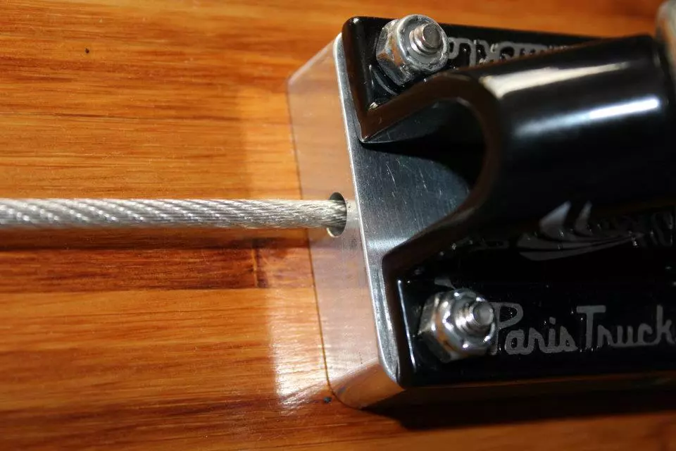 Crank the cable to make the board stiffer or more flexible