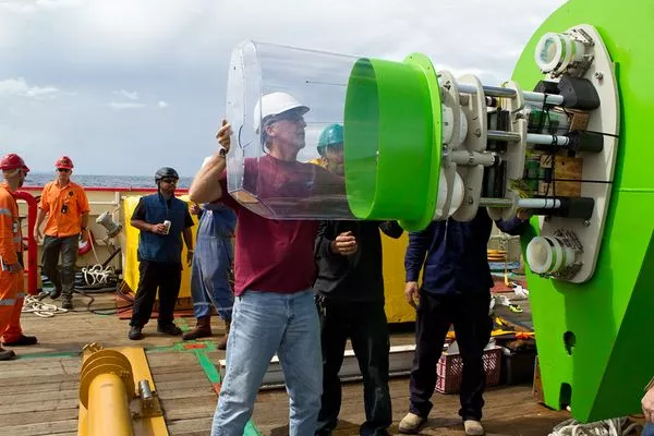 James Cameron fits a casing onto the instrument package atop of the DEEPSEA CHALLENGER sub, shown here lying on its side(Photo: Brook Rushton/DEEPSEA CHALLENGE)