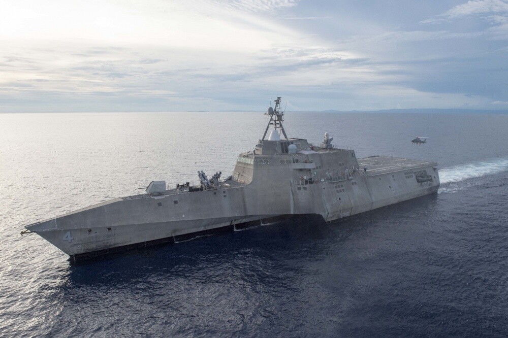 A helicopter from the Philippine Navy prepares to land on the flight deck of littoral combat ship USS Coronado (LCS 4) during an exercise for Maritime Training Activity (MTA) Sama Sama 2017