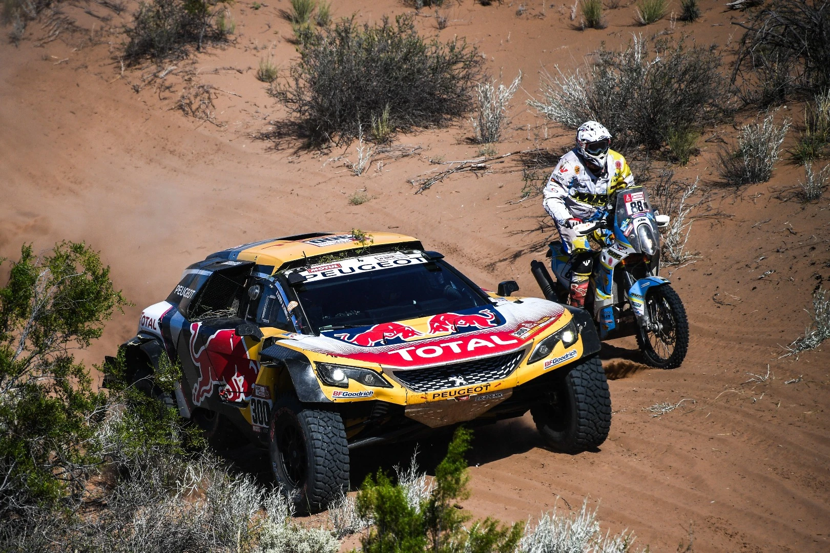 Jan Vesely, on a KTM, finds himself racing side by side with the Toyota of Philippe Raud and Patrice Saint Marc