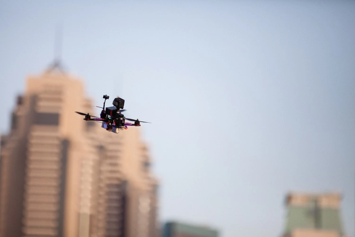 Pilots wear virtual reality headsets and steer their vehicles around the race track in first person view