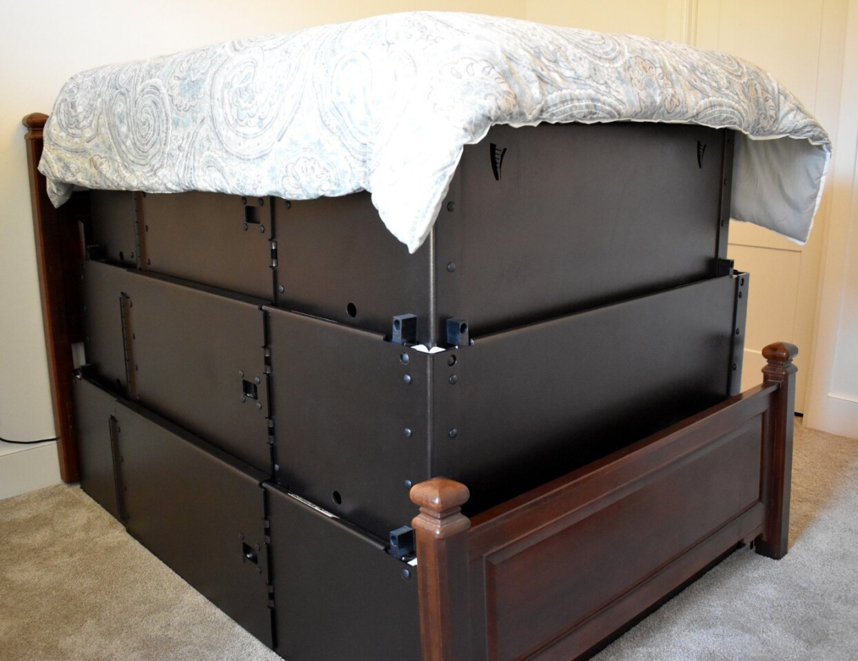 Telescoping bed frame doubles as a tornado shelter