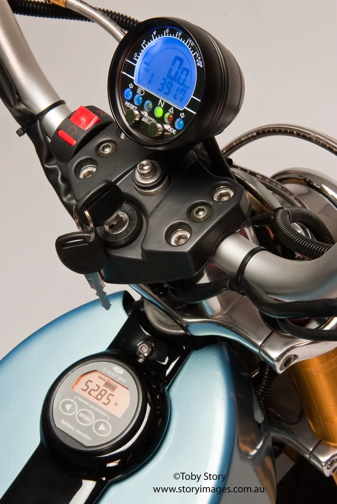 The prototype electric Deliver E-Trike has independently-pivoting rear swing arms, which allow it to stand upright when parked on grades