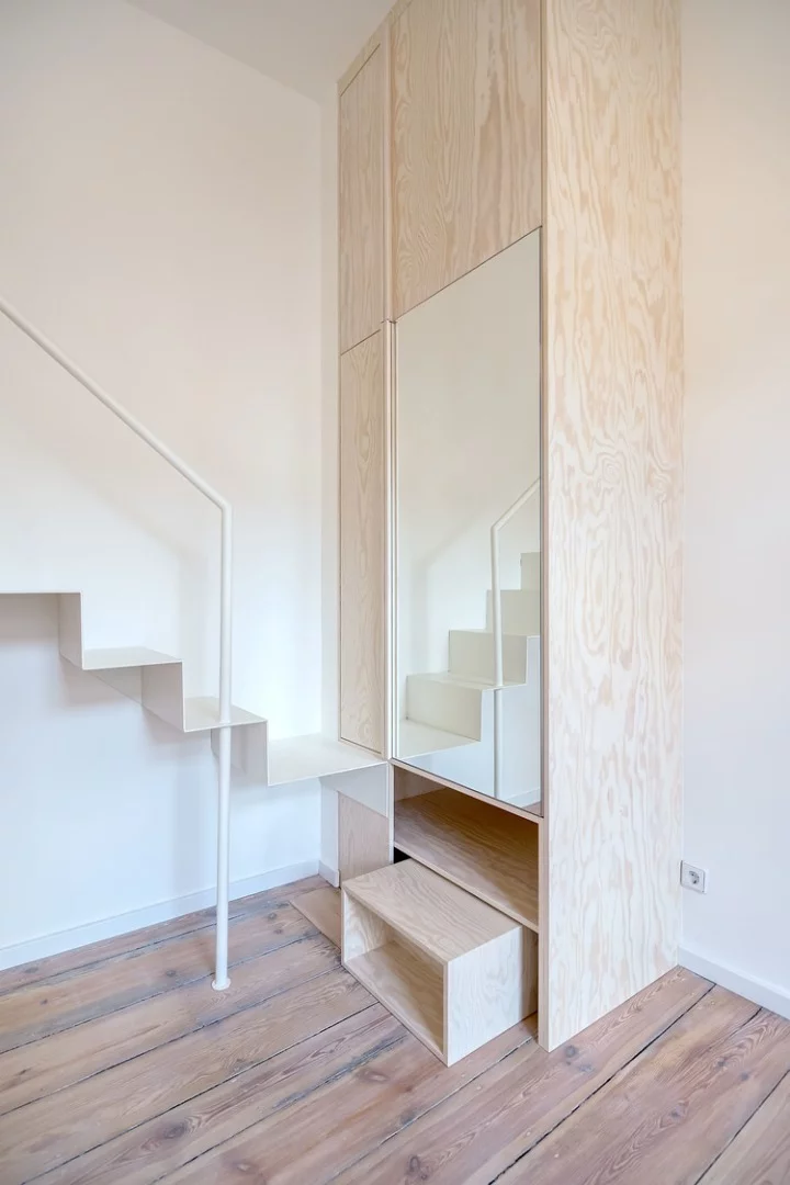 The bottom of the staircase provides access to a dropdown wardrobe (Photo: Ringo Paulusch)