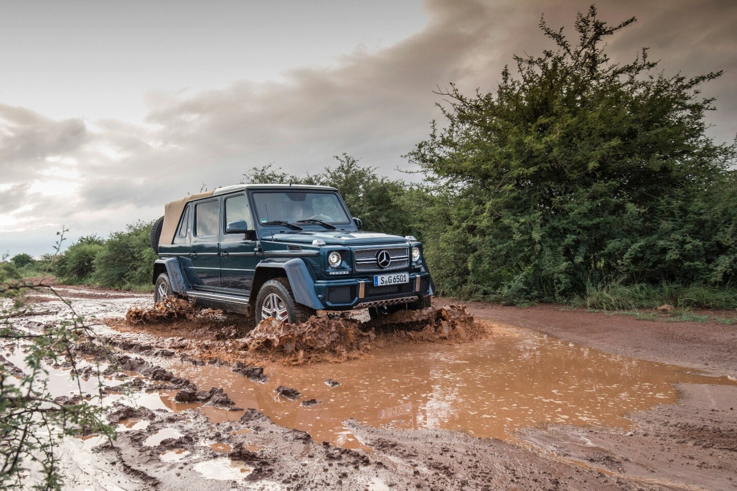 The luxury 7300 pound Maybach G650 Landaulet is more than five meters long and two meters high, with half a meter of ground clearance, and four wheels sharing responsibility for distributing 1000 Nm of torque.