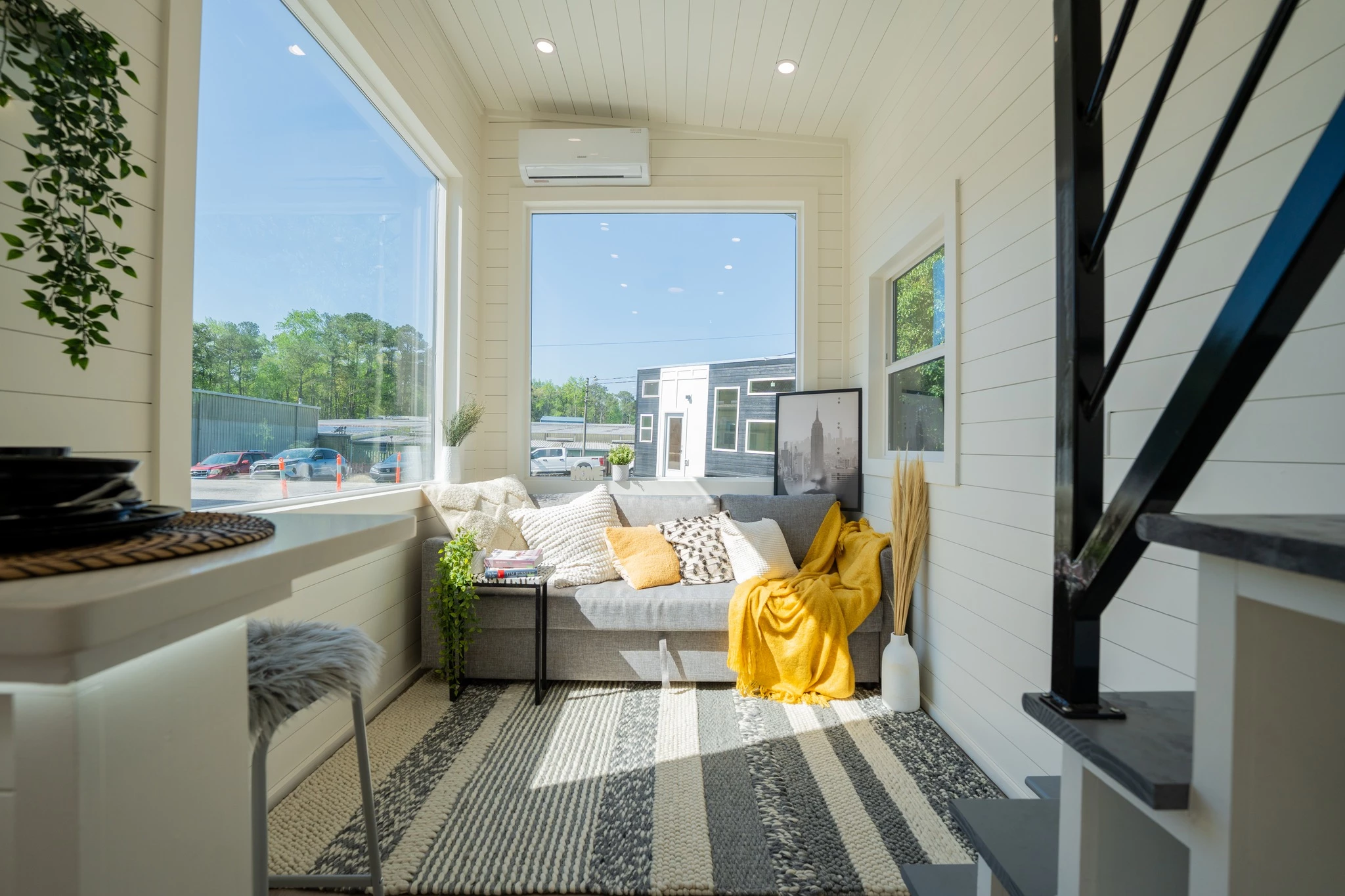 The Aria 24's living room looks light-filled thanks to its generous glazing