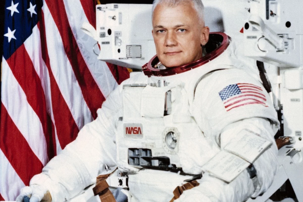 Official Space Shuttle portrait showing Astronaut Bruce McCandless II, attired in the Shuttle Extravehicular Activity (EVA) Suit with Manned Maneuvering Unit (MMU) attached