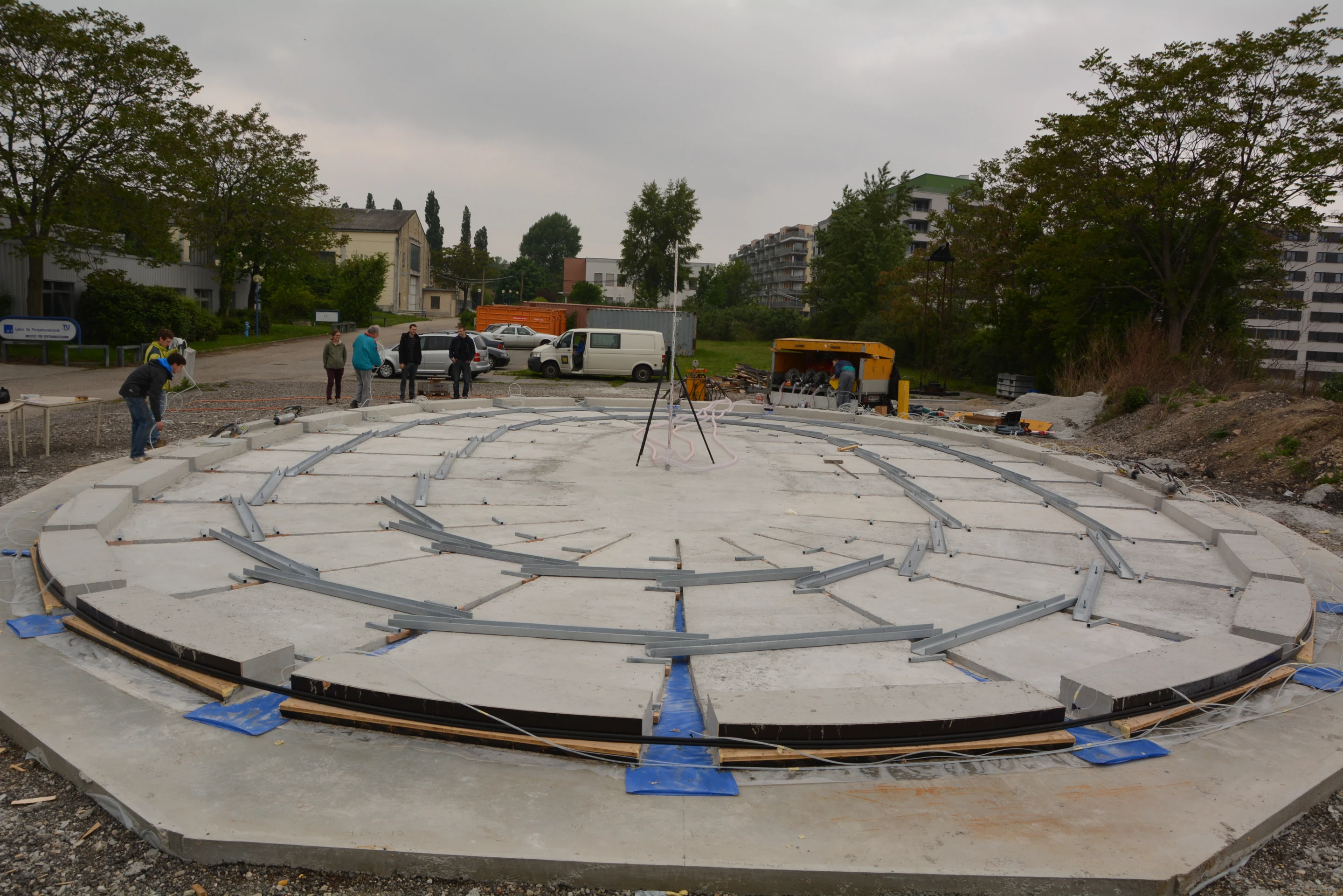 Concrete is then poured into those forms and allowed to harden, resulting in a series of flat slabs