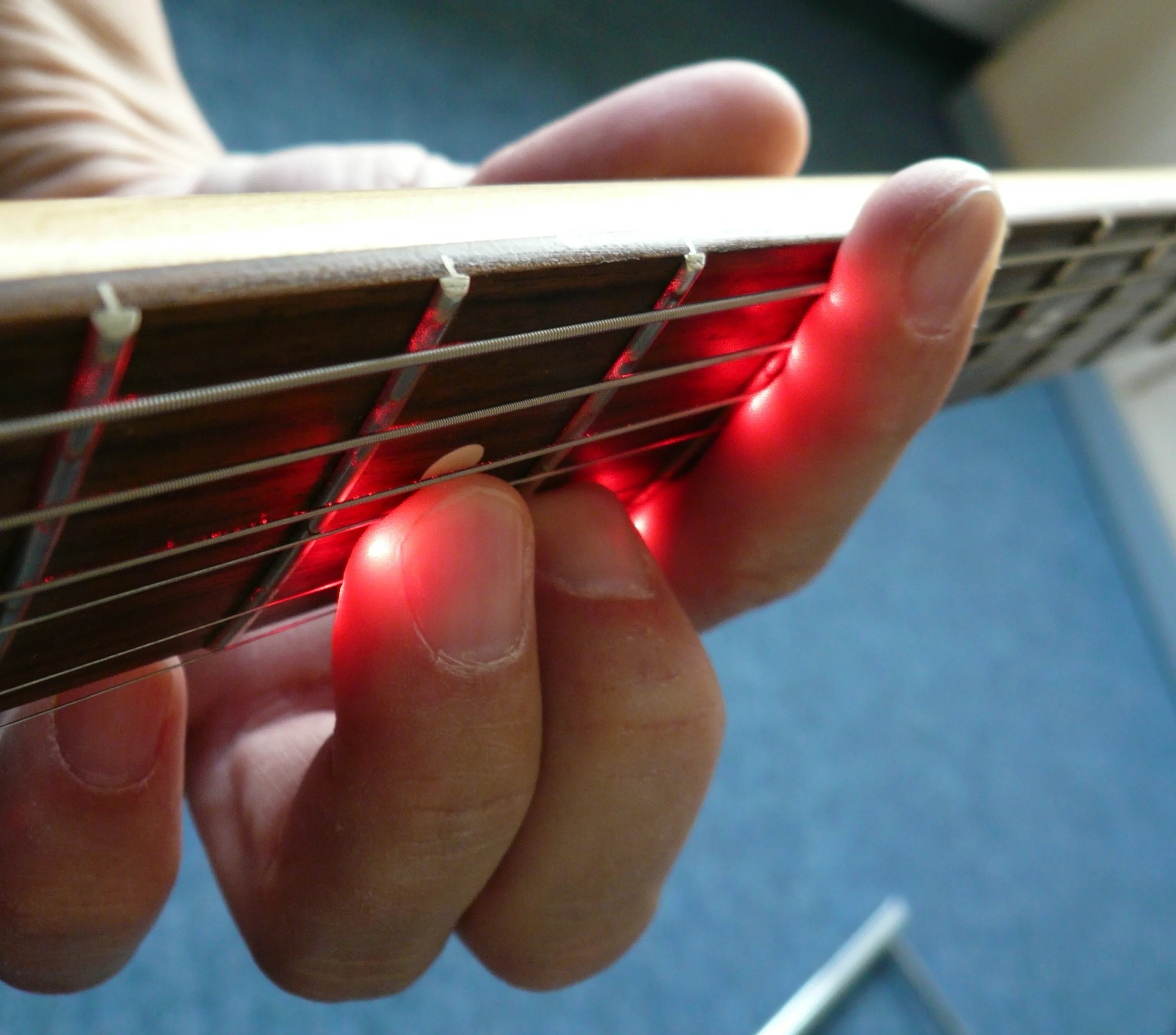 The LPD Pickup system runs a beam under each string, from the bridge to the end of the fingerboard, and monitors its return to photosensitive receptors in the unit