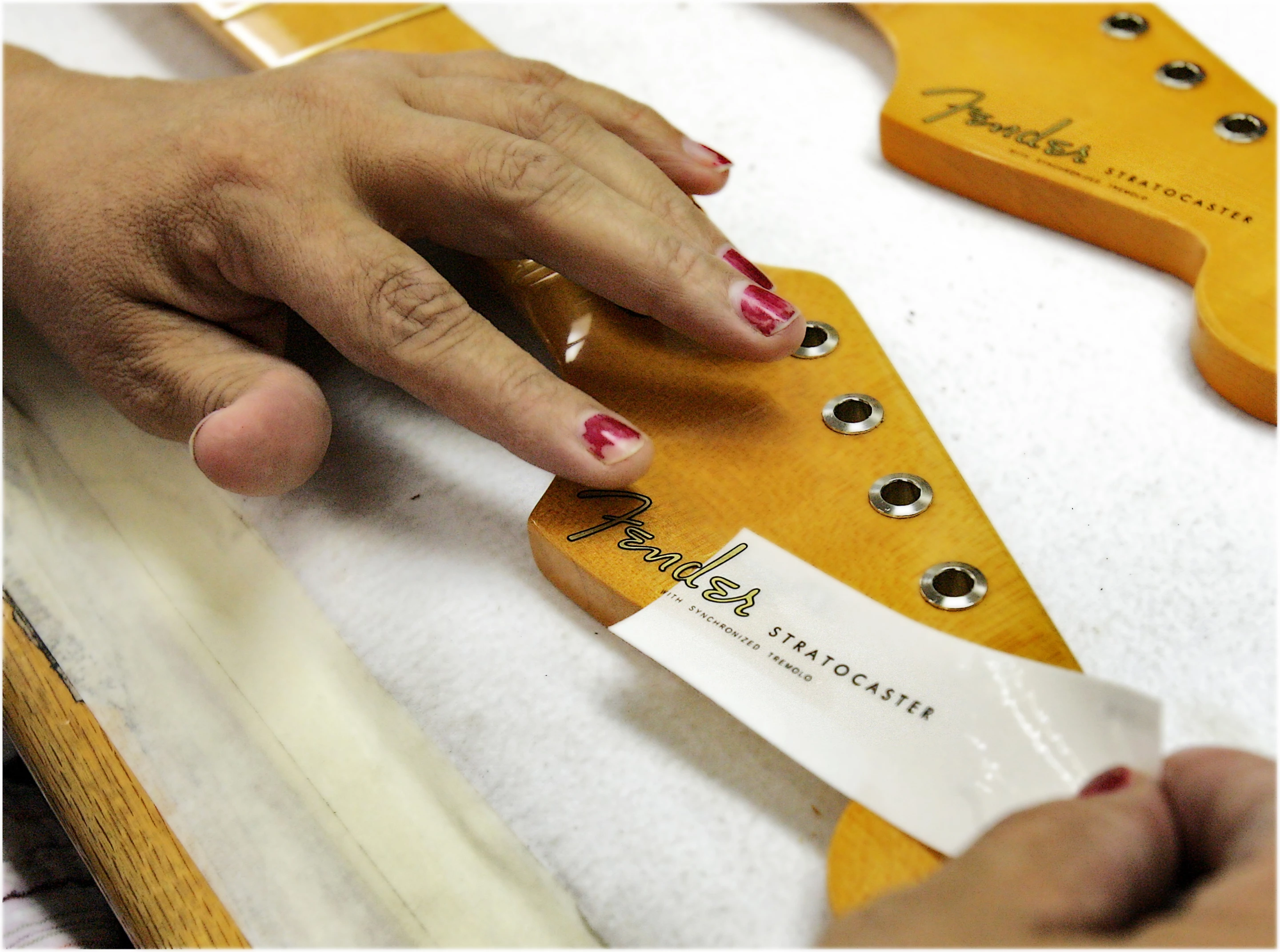 Applying the 'spaghetti' logo to the headstock