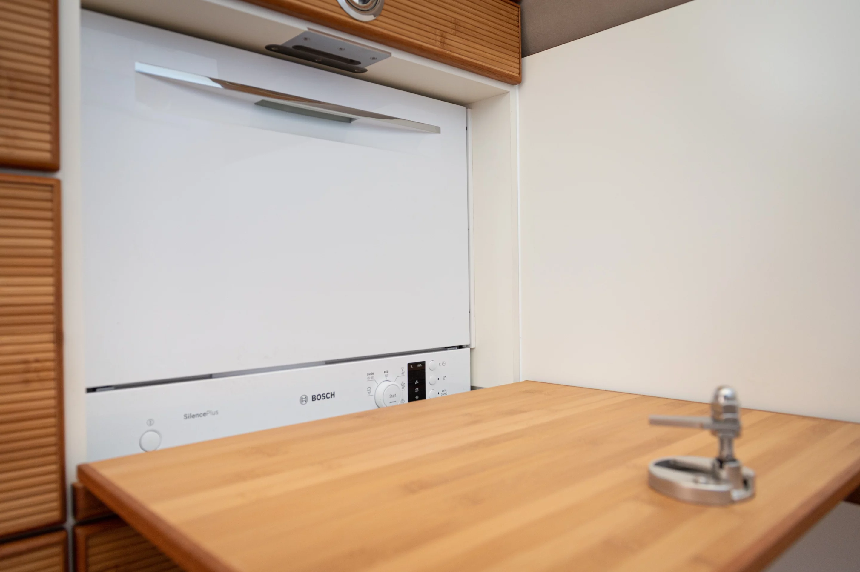 A far cry from the basic water-filled bucket that some use as a camping sink, the Unicat MD56c's dishwasher