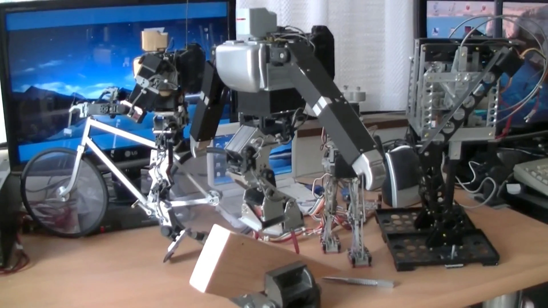 Dr. Guero's hobby robot kit balances on stilts on a 45 degree slope