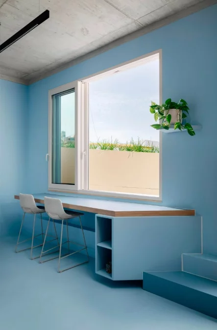 A slim breakfast bar overlooks the terrace