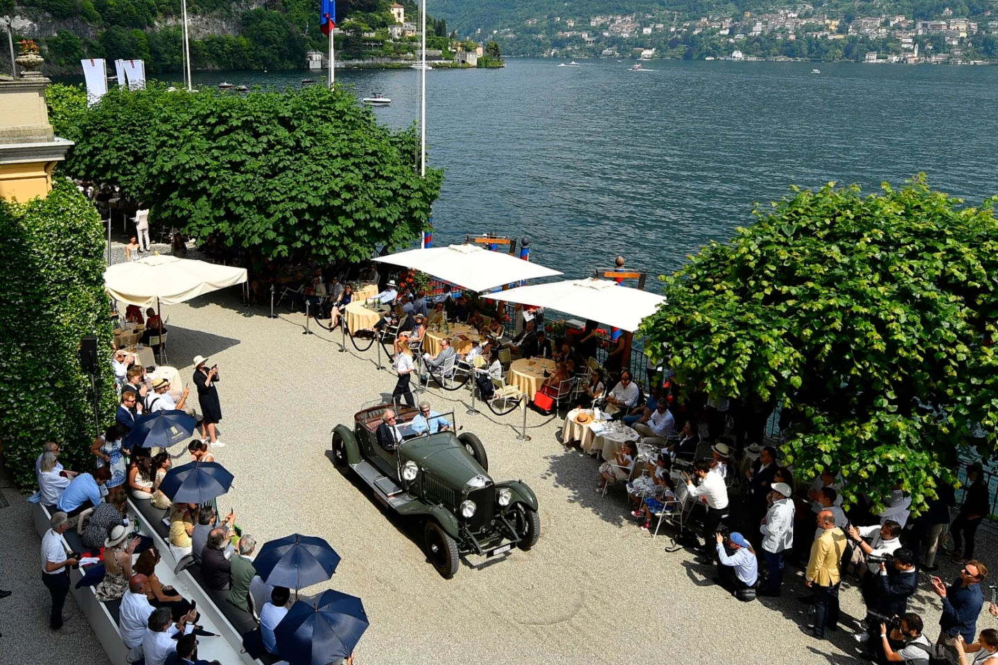 Most cars on display at Villa d'Este arrive by trailer and quite often by aircraft prior to the trailer. Each year, the Automobile Club Como awards a trophy to the car driven from farthest away, and there have been some extensive journeys undertaken to claim this prize. The winning trip this year was shorter than usual, having been driven in this 1928 Bentley 4 1⁄2 Litre Dual Cowl Torpedo by Mauritius van Son from nearby Switzerland. This is, no doubt, a sign of the times, as most of the cars at Villa d'Este are near priceless. Check out the photo library as the "dual cowl" means a second windscreen for the rear seat occupants.