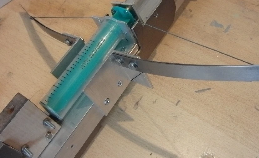 The BB crossbow's syringe and bow