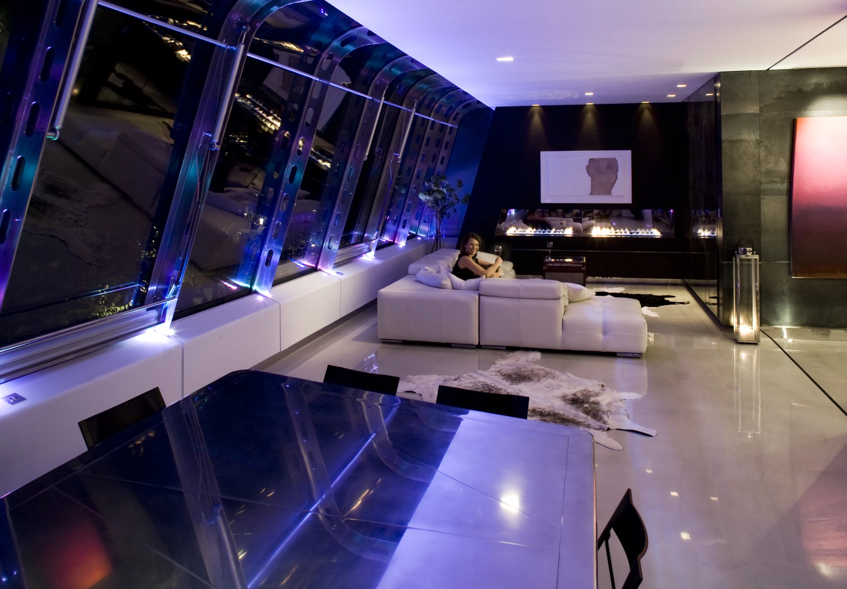 Modern amenities include a full color LED and cold cathode lighting system, controlled by a Lutron home automation unit