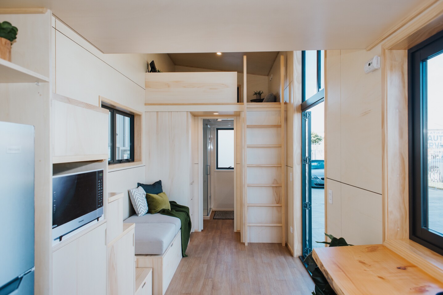 Scotty The Tiny House doesn't have space for much of a living room downstairs and instead has a seating area near the door