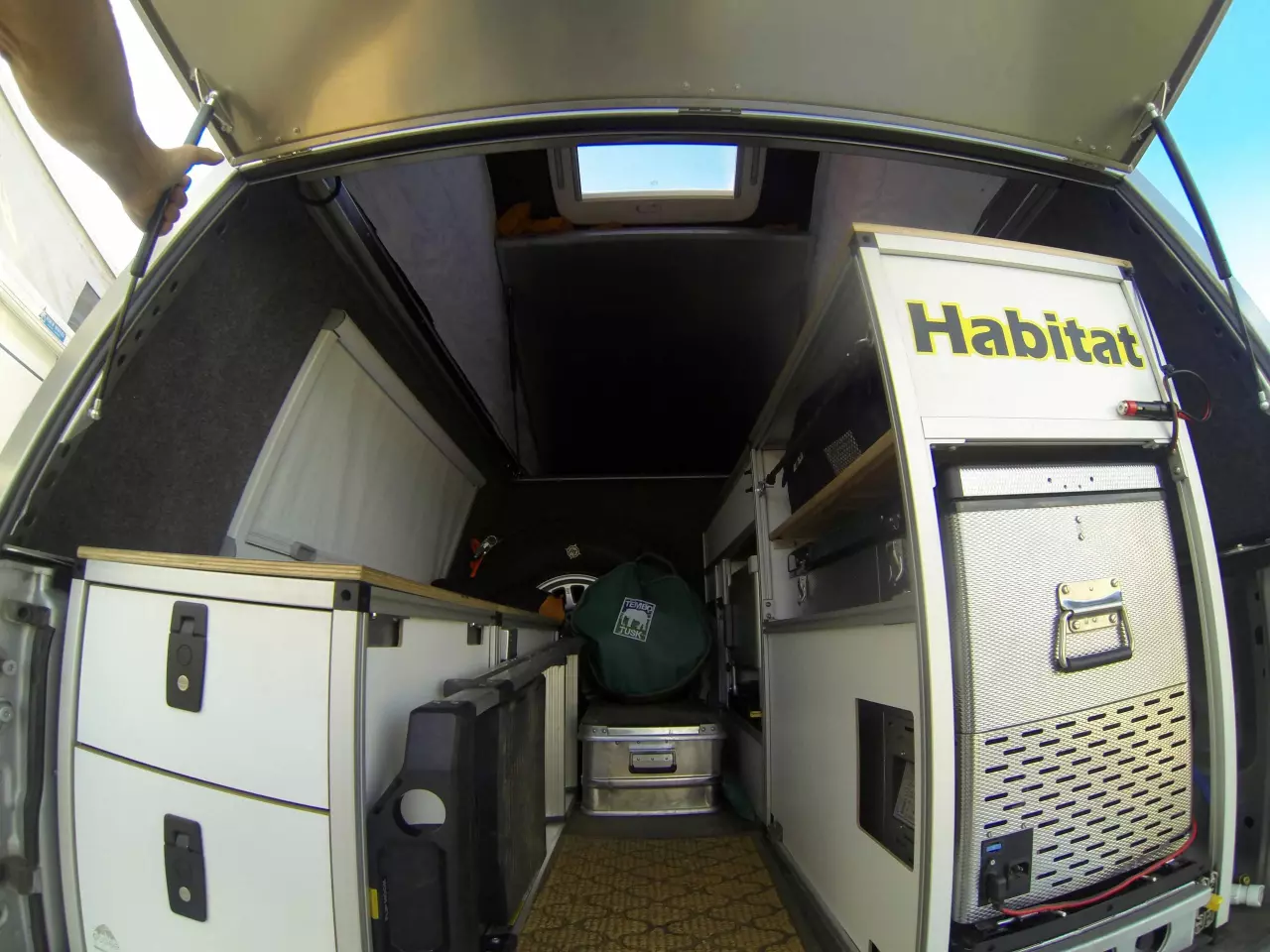 Buyers can leave the interior open for storage or build it up into a more functional camper, as seen in this Tacoma Summit with kitchen gear, storage and more